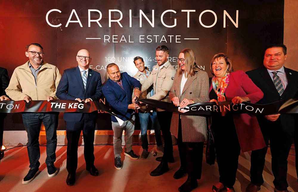 MIKE DEAL / FREE PRESS
From left: Russell Krepart, Mayor Scott Gillingham, Silvano Paletta, Sam Goszer, Jared Carrington, Kate Fenske, Janice Lukes and Jeff Browaty at the ribbon cutting that Carrington Real Estate held to celebrate their new efforts to complete the 185 Donald Street tower.