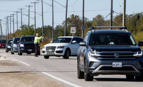 JOHN WOODS / FREE PRESS
                                A police officer directs traffic before and after services at the Oasis Church on Wilkes.