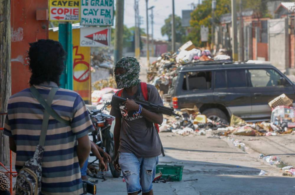Odelyn Joseph / The Associated Press File
Armed gang members still hold significant power in Haiti.