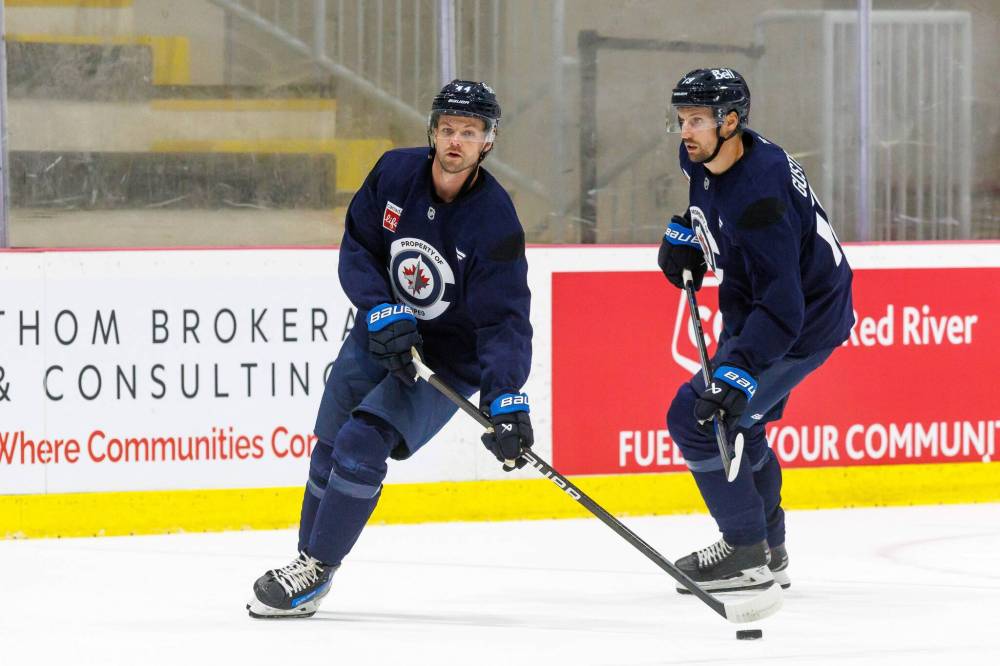 MIKE DEAL / FREE PRESS FILES
Winnipeg Jets’ Josh Morrisssey (44) and David Gustafsson (19) on the first day of training camp in September. Gustafsson said he’s trying not to overthink things at this point in the preseason.