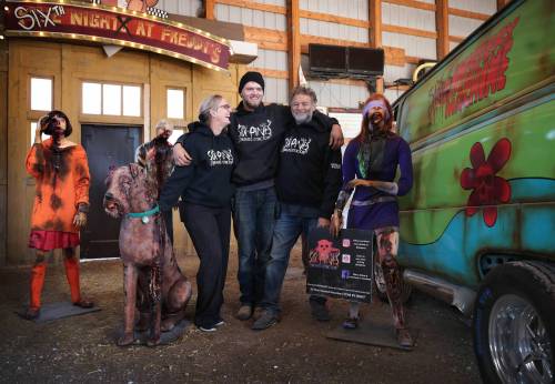RUTH BONNEVILLE / FREE PRESS
James and Judy Thevenot, owners-operators of Six Pines Haunted Attractions, and son Thomas Thevenot. ‘People laughing, people coming up to me at the ticket booth telling me it was so good — that’s my joy,’ Judy says.