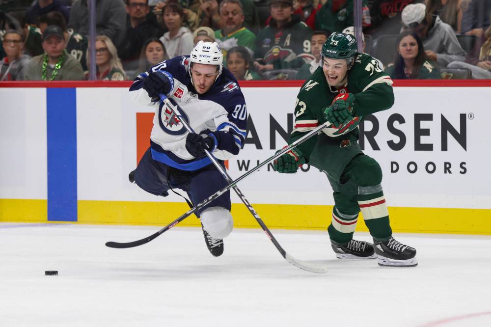 BAILEY HILLESHEIM/ASSOCIATED PRESS FILES
Minnesota Wild defenseman Kyle Masters (73) passes the puck while Winnipeg Jets right wing Nikita Chibrikov (90) challenges during a pre-season game on Sept. 27.