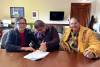SUPPLIED
                                From left: Mother Harriet Sumner-Pruden, son, Alfred &ldquo;Dewey&rdquo; Pruden, and father, Alfred Pruden sign a human rights settlement agreement Monday that will remove the &ldquo;discriminatory&rdquo; eligibility restrictions for youth disability services/home care for First Nations children living on reserve.