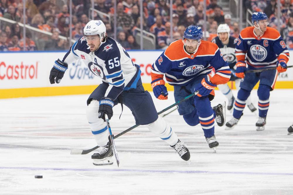 Amber Bracken / THE CANADIAN PRESS
Jets centre Mark Scheifele carries the puck on a breakaway ahead of Edmonton Oilers’ Evan Bouchard during the first period.