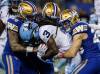 John Woods / THE CANADIAN PRESS
                                Bombers Mike Benson (left), Nick Hallett (centre) and Noah Hallett wrap up Argos kick returner Janarion Grant Friday in Winnipeg.