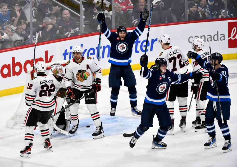 Fred Greenslade / THE CANADIAN PRESS
Mark Scheifele tied the game with 1:04 left in the third period and then scored the winner in OT.