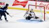 FRED GREENSLADE / THE CANADIAN PRESS
                                Mark Scheifele (left) snaps a shot past Blackhawks goaltender Arvid Soderblom to lift the Jets to a 2-1 overtime win Friday night.