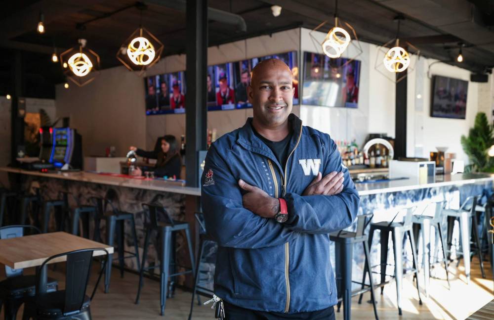 Ravi Ramberran, co-owner of the Saint Restaurant and Pub, in the bar area of the recently opened Portage Avenue location. (Ruth Bonneville / Free Press)
