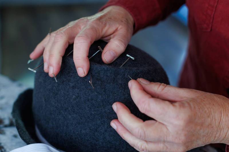 MIKE DEAL / FREE PRESS
Kelly Bekeris, Milliner, pulls out pins that she uses when creating her Sculpted Freeform wool hats.