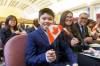 MIKE DEAL / FREE PRESS
                                Marcus Gonzales, 11, waves his Canadian flag Thursday morning after giving his oath of citizenship along with his father, Marchelle (right), mother Lylanie (second from right), and sister, Margaret (left).