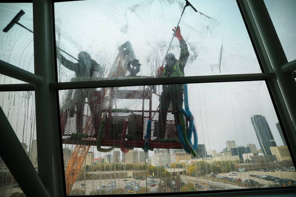 Jayden Vidal-Bircham (left) and Carson Therrien are seen from inside the CMHR. (Ruth Bonneville / Free Press)