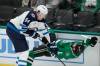 Tony Gutierrez / The Associated Press
                                Jets defenceman Logan Stanley (left) levels Logan Stankoven of the Dallas Stars last season.