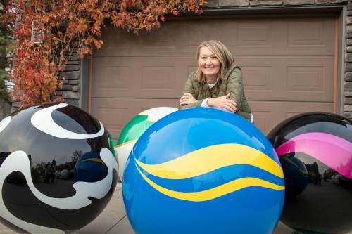 BROOK JONES/FREE PRESS
                                Erica Swendrowski, an artist and landscape designer, is refurbishing the marbles she created as a public art piece dubbed Marbles at Mayfair
