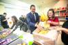 MIKAELA MACKENZIE / FREE PRESS
                                MLA Tracy Schmidt (left), Deputy Prime Minister Chrystia Freeland, and Premier Wab Kinew pack snack bins for Marion School classrooms Friday.