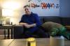 Ruth Bonneville / Free Press 
                                Now mostly bedridden by increasing discomfort, Shane Komar sits stiffly on his couch, tears welling up as he describes the pain and frustration of waiting for back surgery since 2018.