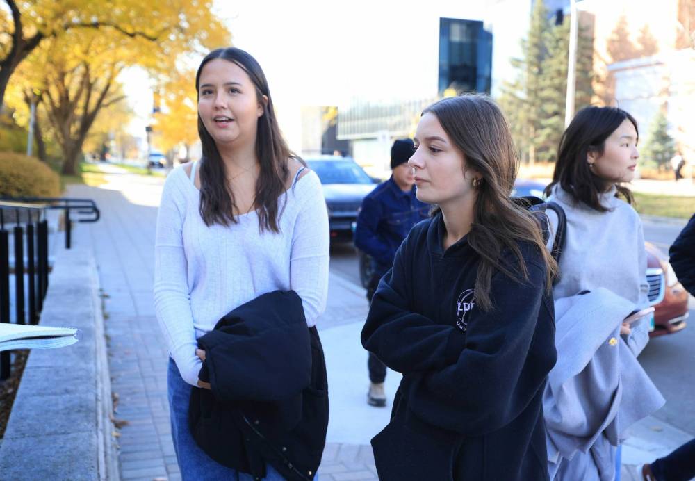 Ruth Bonneville / Free Press
Hailey Sanderson (left), with her friend Damarah Juba, said she had to call security once when an intoxicated man knocked on her door and attempted to enter her room.