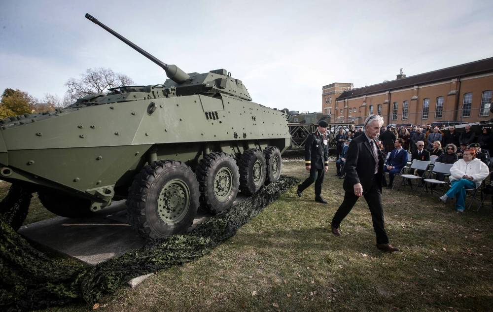 JOHN WOODS / FREE PRESS
Jim Seggie (right), father of Corporal Michael Seggie who was killed in Afghanistan September 2008, walks away after unveiling a light armoured vehicle (LAV) as a monument to those who lost their lives in Afghanistan at a ceremony at the armoury at the corner of McGregor Street and Cathedral Avenue.