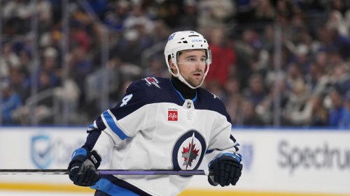 Winnipeg Jets' Neal Pionk wears a neck guard as he plays during the third period of an NHL hockey game against the St. Louis Blues Tuesday, Nov. 7, 2023, in St. Louis. Officials made presentations at the league's annual Toronto meeting on both cut-proof equipment and emergency standards in arenas.THE CANADIAN PRESS/AP-Jeff Roberson