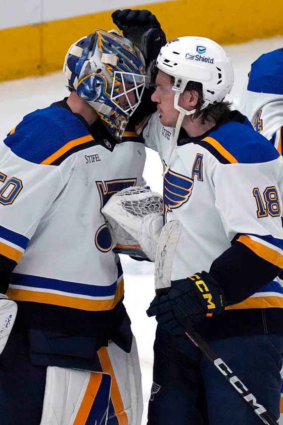 St. Louis Blues goaltender Jordan Binnington, left, with center Robert Thomas during last season. (Nam Y. Huh / Associated Press files)