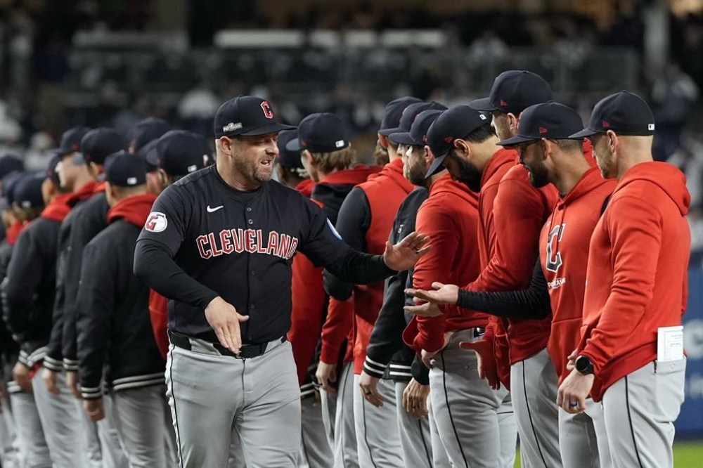 Cleveland Guardians manager Stephen Vogt greets players before Game 1 of the baseball AL Championship Series against the New York Yankees Monday, Oct. 14, 2024, in New York. (AP Photo/Godofredo Vásquez )