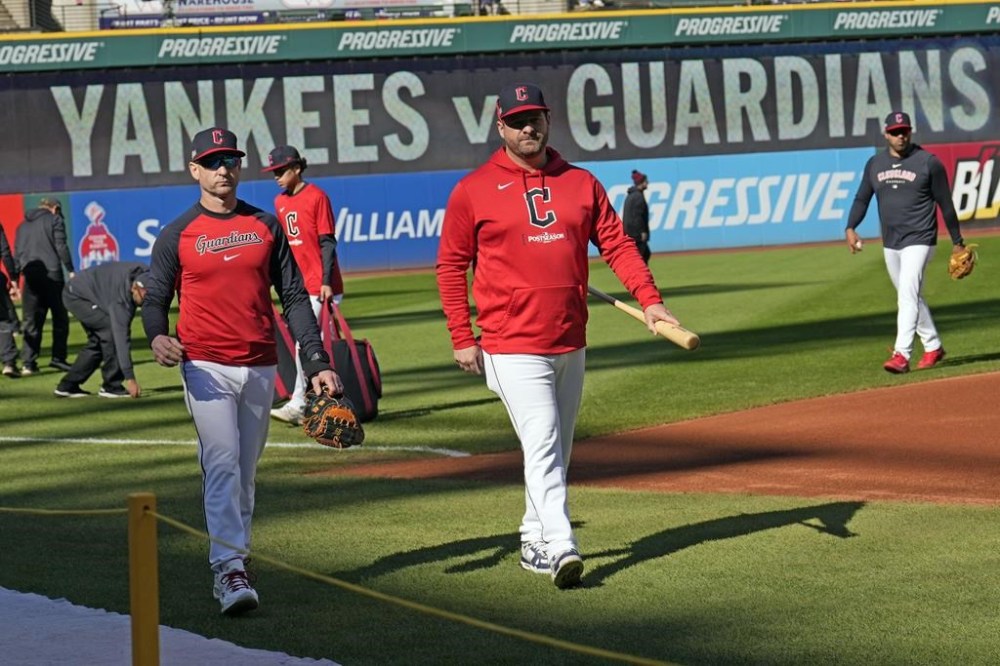 Cleveland Guardians manager Stephen Vogt, right, and bench coach Craig Albernaz walk along the infield during batting practice before Game 3 of the baseball AL Championship Series against the New York Yankees Thursday, Oct. 17, 2024, in Cleveland.(AP Photo/Sue Ogrocki)