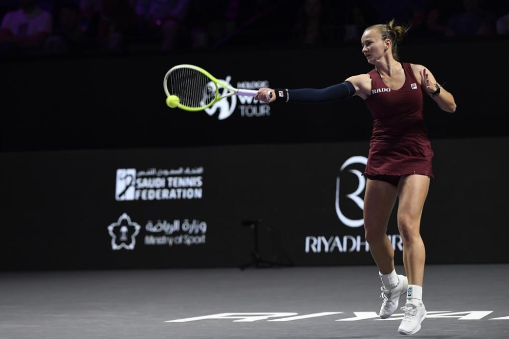 Czech Republic's Barbora Krejcikova shoots against China's Qinwen Zheng during their women's singles semi final match at King Saud University Indoor Arena, in Riyadh, Saudi Arabia, Friday, Nov. 8, 2024. (AP Photo)