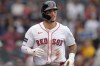 FILE - Boston Red Sox outfielder Jarren Duran, center, returns to the dugout after scoring on an error after Vaughn Grissom hit a double in the third inning of a baseball game against the Tampa Bay Rays, Sept. 29, 2024, in Boston. (AP Photo/Steven Senne, File)