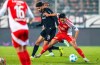 Freiburg's Eren Dinkci, centre, and Berlin's Woo-yeong Jeong, right, fight for the ball during the German Bundesliga soccer match between FC Union Berlin and SC Freiburg in Berlin, Friday, Nov. 8, 2024. (Andreas Gora/dpa via AP)