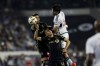 Vancouver Whitecaps' Brian White, right, vies for the ball against Los Angeles FC's Sergi Palencia, center, and Los Angeles FC's Eduard Atuesta during the second half of a first-round MLS Cup playoffs soccer match, Friday, Nov. 8, 2024, in Los Angeles. (AP Photo/Etienne Laurent)