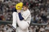 FILE - Roki Sasaki of Japan pitches during their Pool B game against the Czech Republic at the World Baseball Classic at the Tokyo Dome in Tokyo, on March 11, 2023. (AP Photo/Eugene Hoshiko)