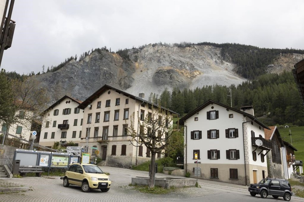 FILE - Residential buildings stand in front of the