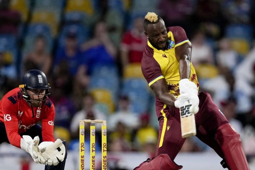 West Indies' Andre Russell plays a shot from a delivery of England's Adil Rashid during the first T20 cricket match at Kensington Oval in Bridgetown, Barbados, Saturday, Nov. 9, 2024. (AP Photo/Ricardo Mazalan)