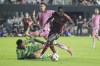 Inter Miami goalkeeper Drake Callender (1) defends Atlanta United forward Jamal ThiarÈ (29) during the first half of their MLS playoff opening round soccer match, Saturday, Nov. 9, 2024, in Fort Lauderdale, Fla. (AP Photo/Lynne Sladky)