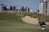 Paul Waring of England lines up a putt on the 1st green in the final round of Abu Dhabi Golf Championship in Abu Dhabi, United Arab Emirates, Sunday, Nov. 10, 2024. (AP Photo/Altaf Qadri)
