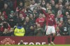 Manchester United's Bruno Fernandes celebrates after scoring his side's first goal during the English Premier League soccer match between Manchester United and Leicester City, at the Old Trafford stadium in Manchester, England, Sunday, Nov.10, 2024. (AP Photo/Jon Super)