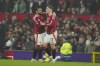 Manchester United's Alejandro Garnacho , right, celebrates with his teammate Bruno Fernandes after scoring his side's third goal during the English Premier League soccer match between Manchester United and Leicester City, at the Old Trafford stadium in Manchester, England, Sunday, Nov.10, 2024. (AP Photo/Jon Super)