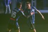 Udinese's Mario Palasic, right, celebrates with Raoul Bellanova after scoring the equalizing goal during a Serie A soccer match between Atalanta and Udinese, at Gewiss Stadium in Bergamo, Italy, Sunday, Nov. 10, 2024. (Spada/LaPresse via AP)