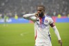 Lyon's Alexandre Lacazette celebrates after scoring a goal during the French League One soccer match between Lyon and Saint-Etienne at the Groupama stadium in Decines, outside Lyon, France, Sunday, Nov. 10, 2024. (AP Photo/Laurent Cipriani)