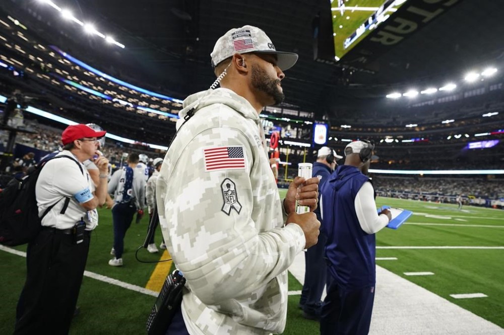 Dallas Cowboys' Dak Prescott watches play against the Philadelphia Eagles in the second half of an NFL football game in Arlington, Texas, Sunday, Nov. 10, 2024. (AP Photo/Jeffrey McWhorter)