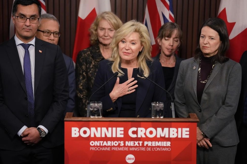 Ontario Liberal Leader Bonnie Crombie stands with Liberal caucus members as she talks to the media at the Queens Park Legislature in Toronto on Tuesday, Dec. 5, 2023. THE CANADIAN PRESS/Chris Young