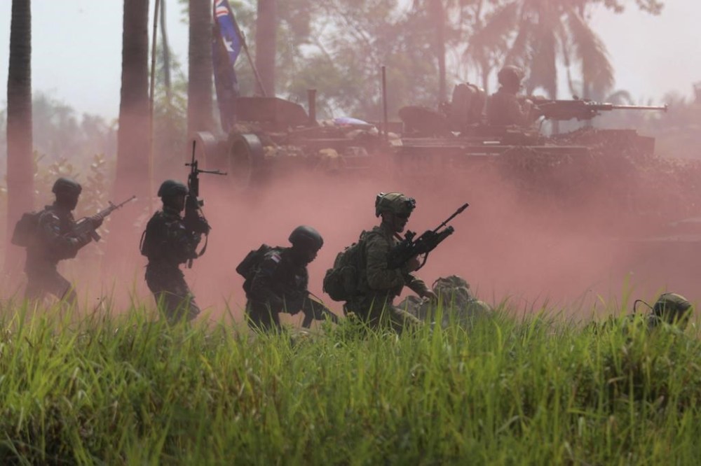 Australian soldiers and Indonesian marines conduct a maneuver during a joint amphibious landing exercise on Banongan Beach, Situbondo, Indonesia, Wednesday, Nov. 13, 2024. (AP Photo/Trisnadi)
