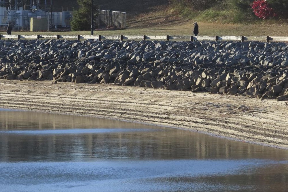 Water levels sit below normal at the Brick Reservoir in Brick N.J., on Tuesday, Nov. 12, 2024 amid record-breaking dry conditions in New Jersey. (AP Photo/Wayne Parry)