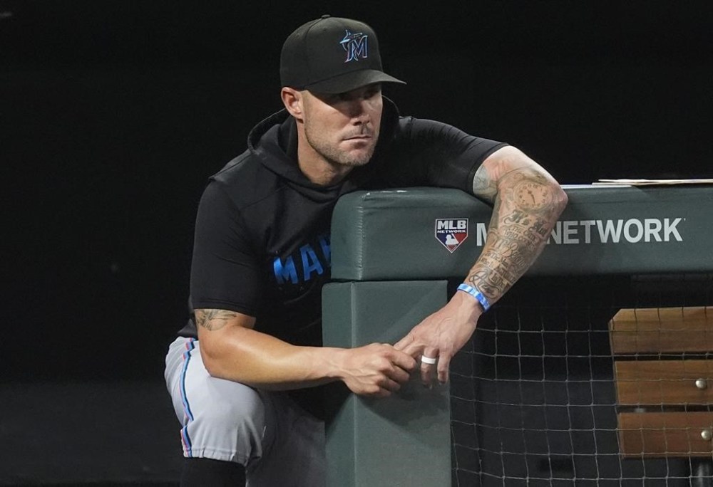 FILE - Miami Marlins manager Skip Schumaker looks on during the eighth inning of a baseball game against the Colorado Rockies, Aug. 27, 2024, in Denver. (AP Photo/David Zalubowski, File)