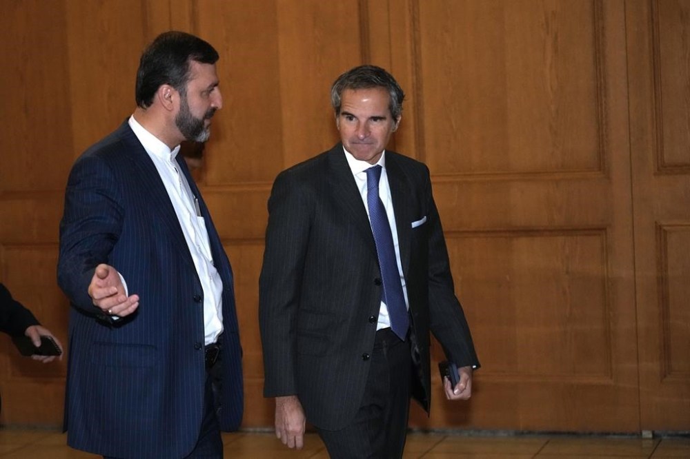 CORRECTS TO INTERNATIONAL ATOMIC ENERGY AGENCY - International Atomic Energy Agency (IAEA) Director General Rafael Mariano Grossi, right, arrives for a meeting with Iranian Foreign Minister Abbas Araghchi as he is accompanied by Deputy Foreign Minister Kazem Gharib Abadi, in Tehran, Iran, Thursday, Nov. 14, 2024. (AP Photo/Vahid Salemi)