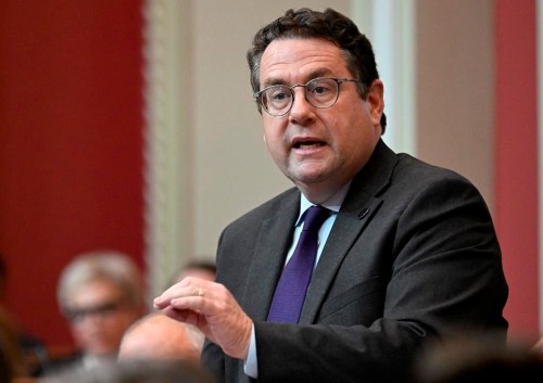 Quebec Education Minister Bernard Drainville responds to the Opposition during question period at the legislature in Quebec City, Tuesday, Oct. 22, 2024. Quebec's education minister says his department will investigate complaints at 17 schools across the province alleging state secularism isn't being respected at those institutions. THE CANADIAN PRESS/Jacques Boissinot