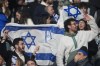 Israel supporters react during the UEFA Nations League soccer match between France and Israel at the Sea de de France stadium in Saint-Denis, outside Paris, Thursday Nov. 14, 2024. (AP Photo/Michel Euler)