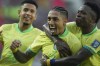Brazil's Raphinha, center, celebrates with teammate Vinicius Junior, right, after scoring his side's opening goal against Venezuela during a FIFA World Cup 2026 qualifying soccer match at Monumental stadium in Maturin, Venezuela, Thursday, Nov. 14, 2024. (AP Photo/Ariana Cubillos)