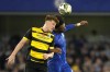Barrow's Ged Garner, left, challenges for the ball with Chelsea's Renato Veiga during the English League Cup third-round soccer match between Chelsea and Barrow at Stamford Bridge stadium in London, Sept. 24. Newfoundland and Labrador's return on investment for sponsoring a professional British soccer team was not quite as rosy as previously stated. THE CANADIAN PRESS/AP, Kirsty Wigglesworth
