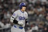 Los Angeles Dodgers' Shohei Ohtani walks to the dugout after a pop out against the New York Yankees during the seventh inning in Game 3 of the baseball World Series, Monday, Oct. 28, 2024, in New York. (AP Photo/Ashley Landis)