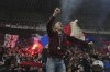 Fans of Lyon celebrate victory after the French League One soccer match between Lyon and Saint-Etienne at the Groupama stadium in Decines, outside Lyon, France, Sunday, Nov. 10, 2024. (AP Photo/Laurent Cipriani)